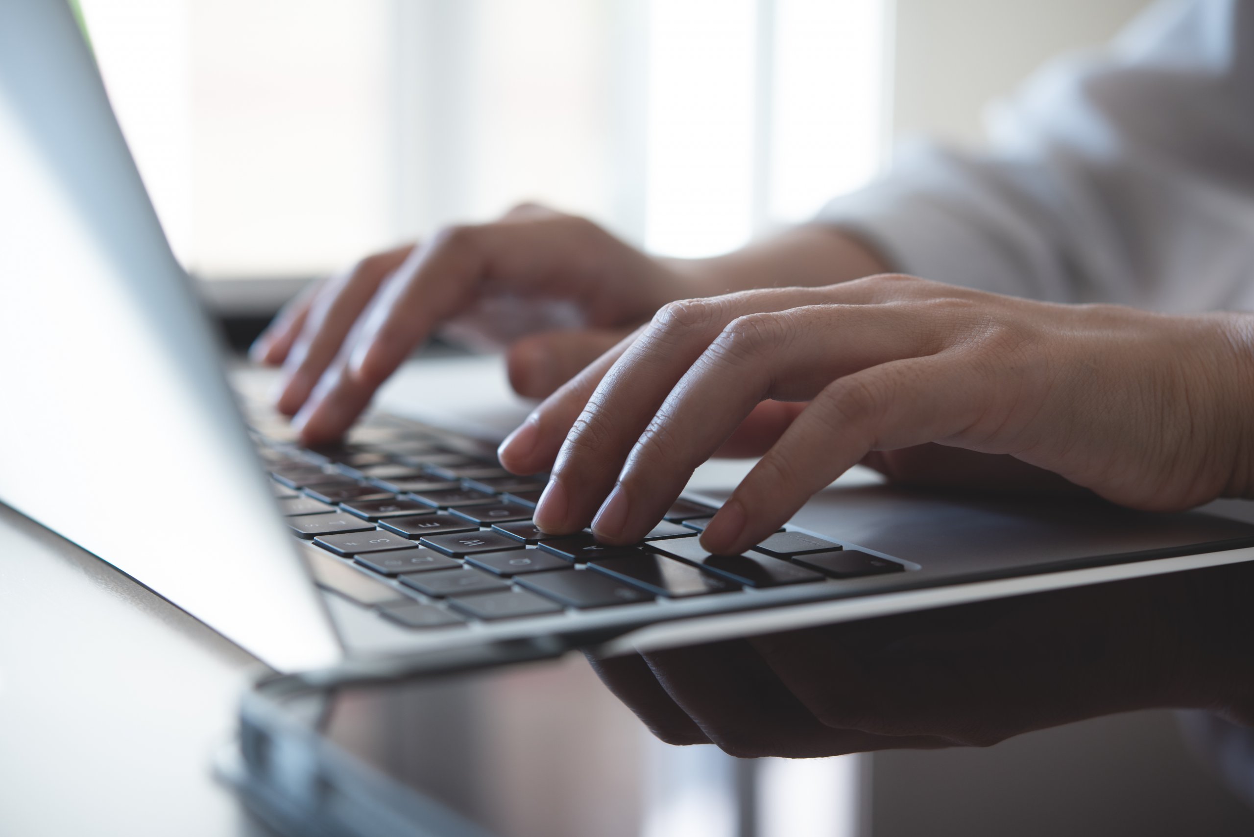 Close up, woman hands typing on laptop computer keyboard, surfing the internet on office table, online, working, business and technology, internet network communication concept